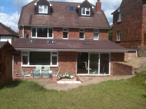 Single story extension with sliding doors, Velux windows installed on a pitch tiled roof