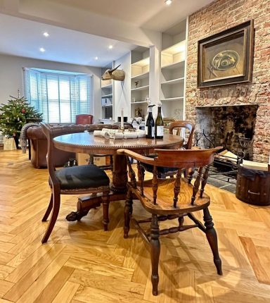 Antique table on herringbone oak flooring