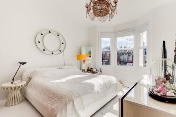 Bright white bedroom, white walls & floor