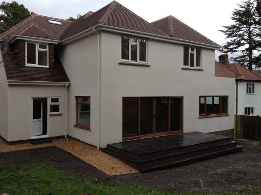 Two story extension, cream render exterior